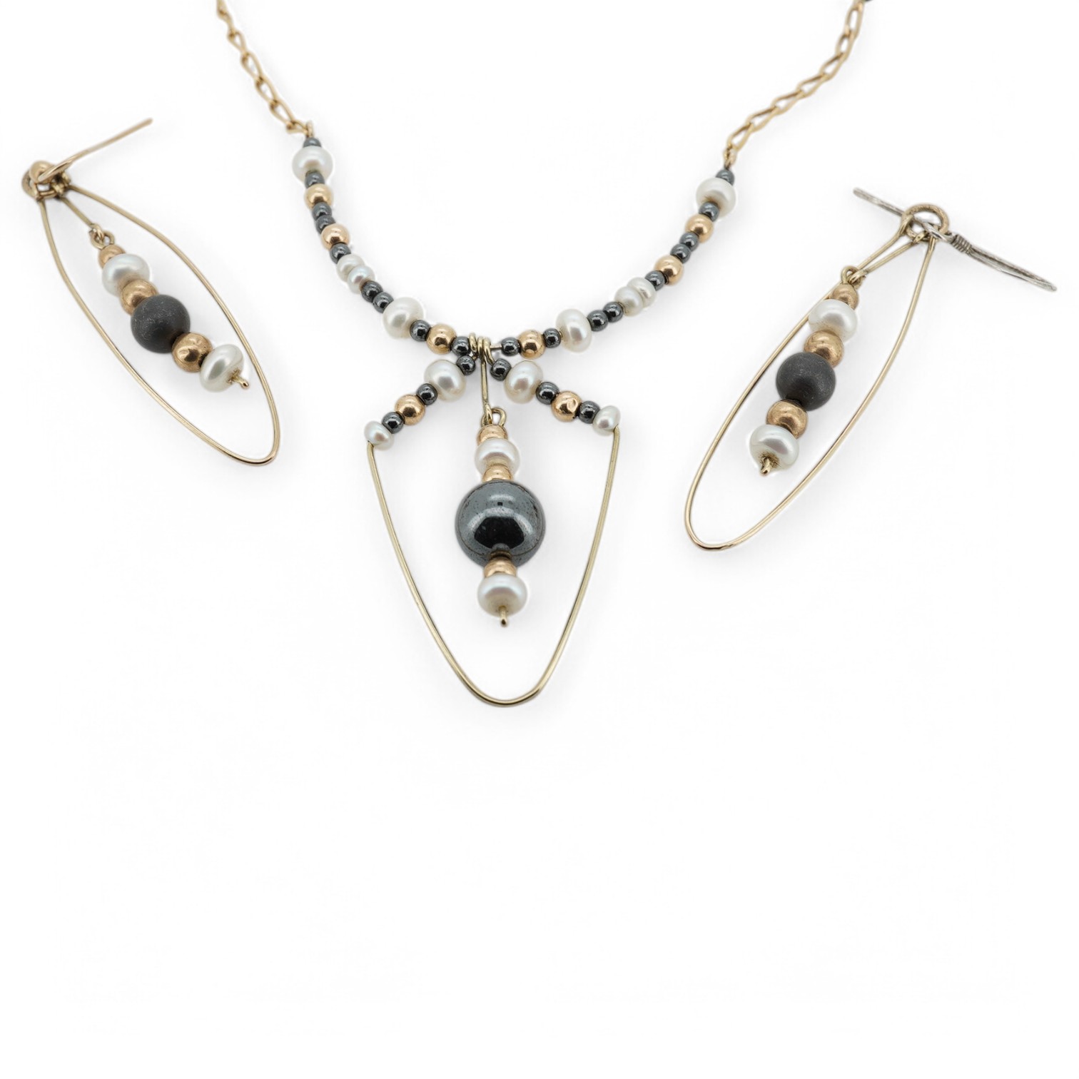 A modern Uno-A-Erre 9ct gold seed pearl and hematite cluster set necklace, approx. 40cm, with a pair of similar drop earrings, gross weight 10 grams. Condition - fair